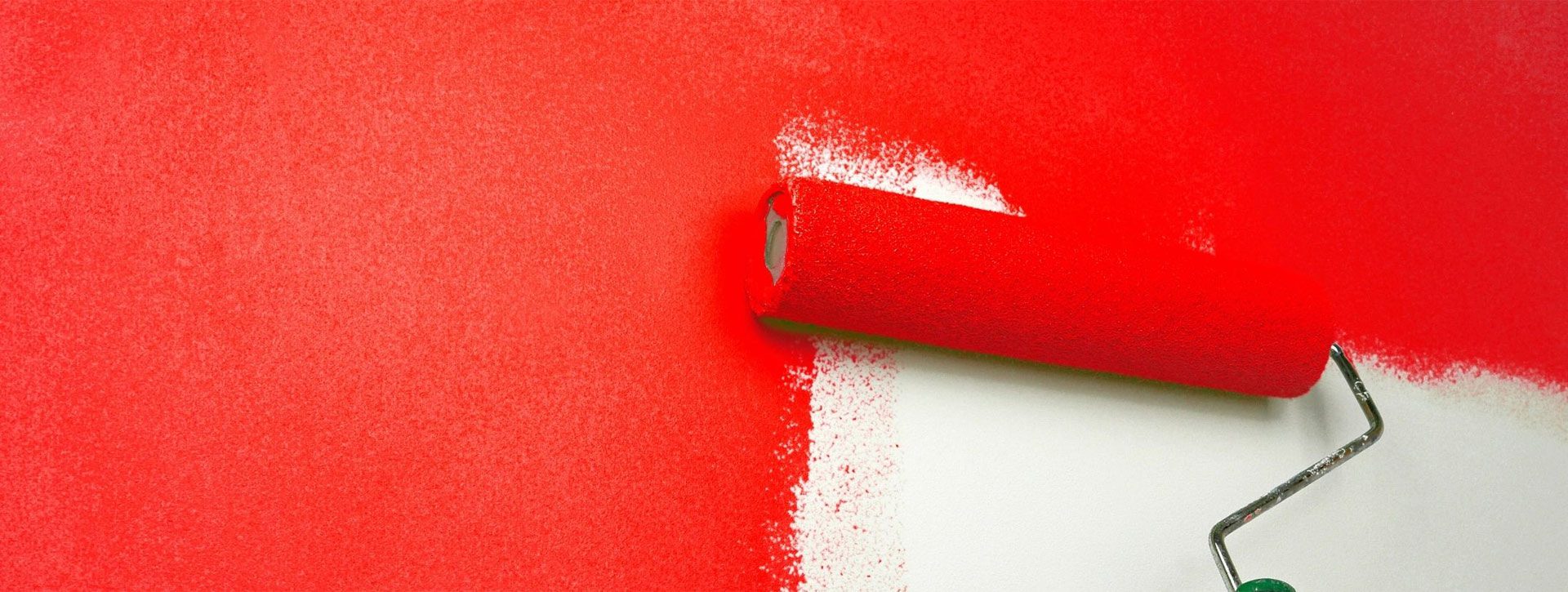 A roll of red paint with white streaks.