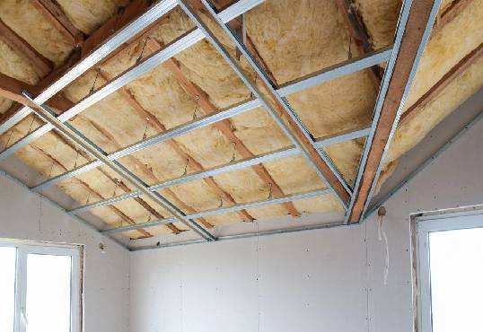 A room with some insulation on the ceiling