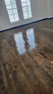 A wooden floor with water on it